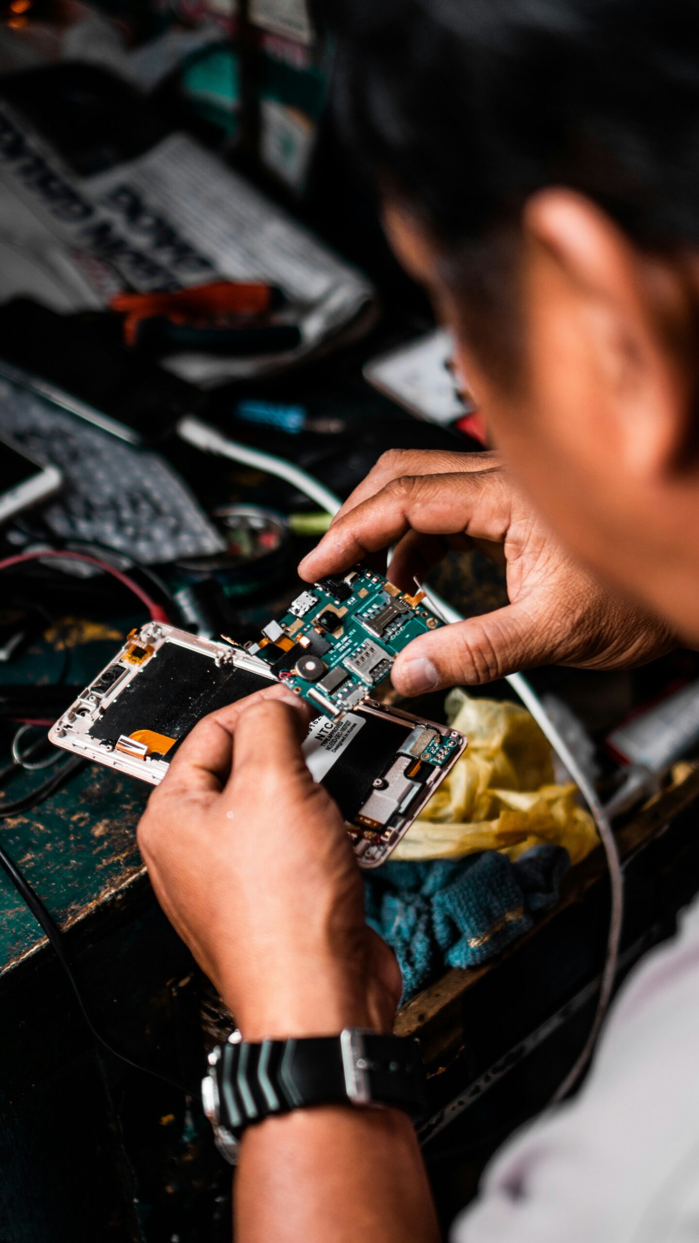 A smartphone being prepared for a repair shop visit