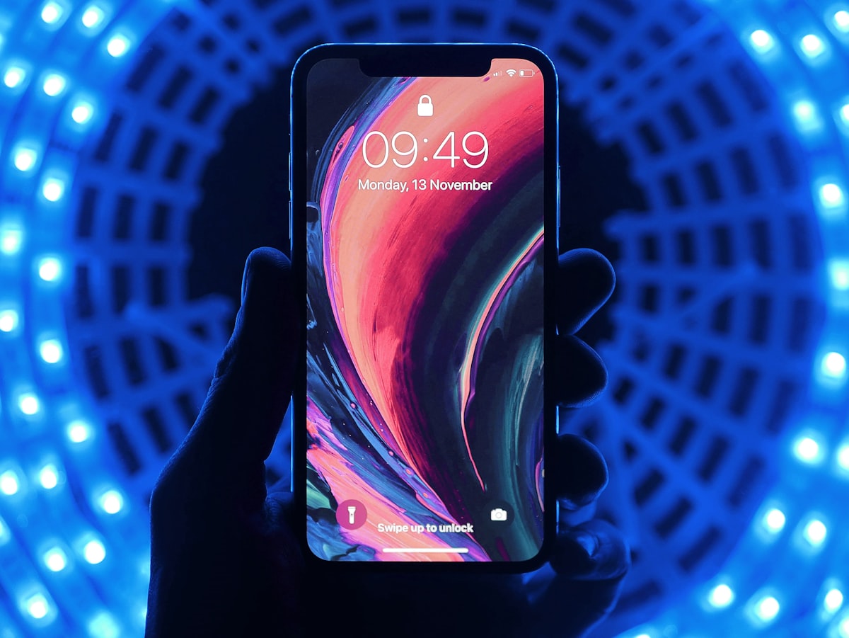 Person holding a repaired smartphone