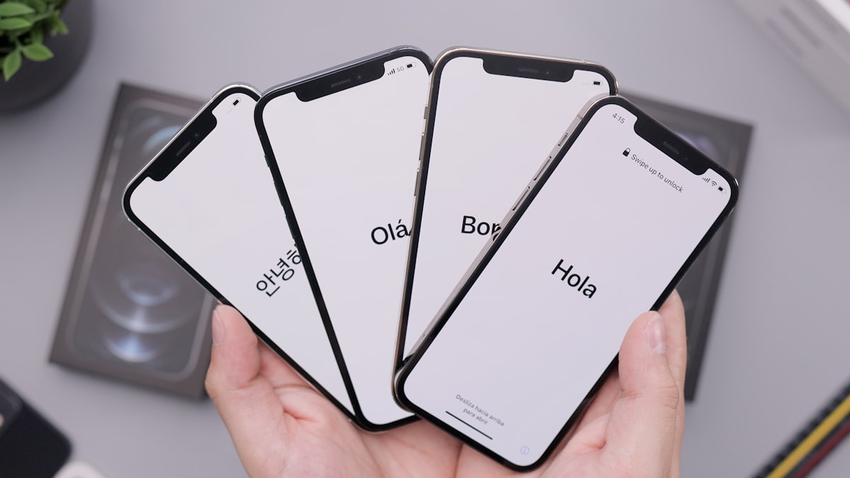 Person examining a used iPhone before buying